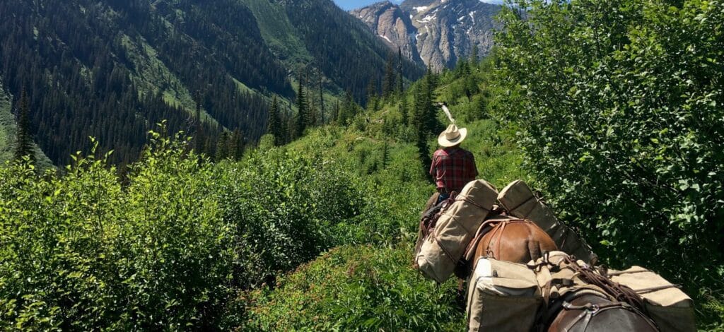 Image of people riding horseback in Montana
