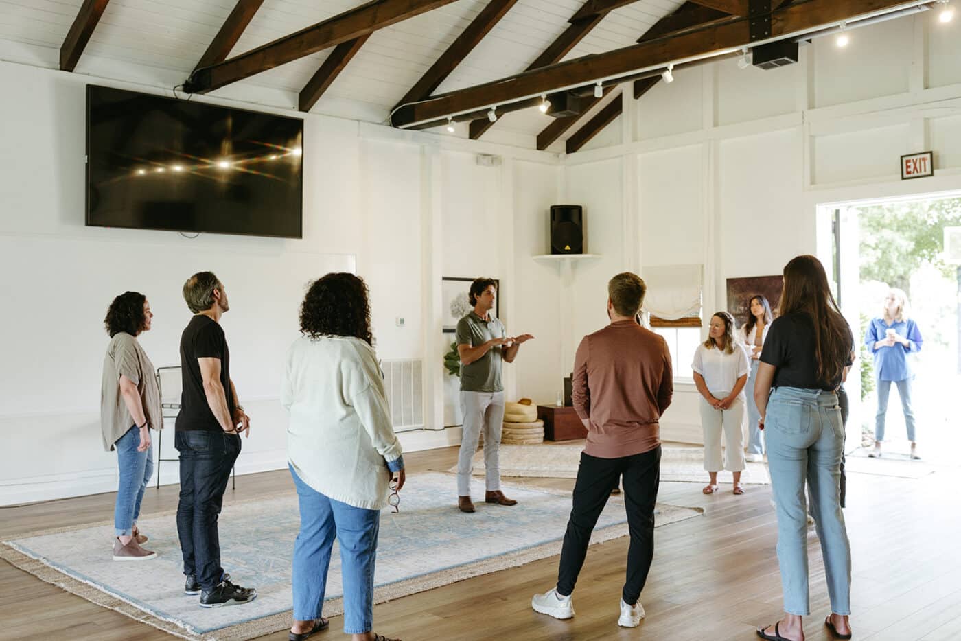 group of people listening to a speaker