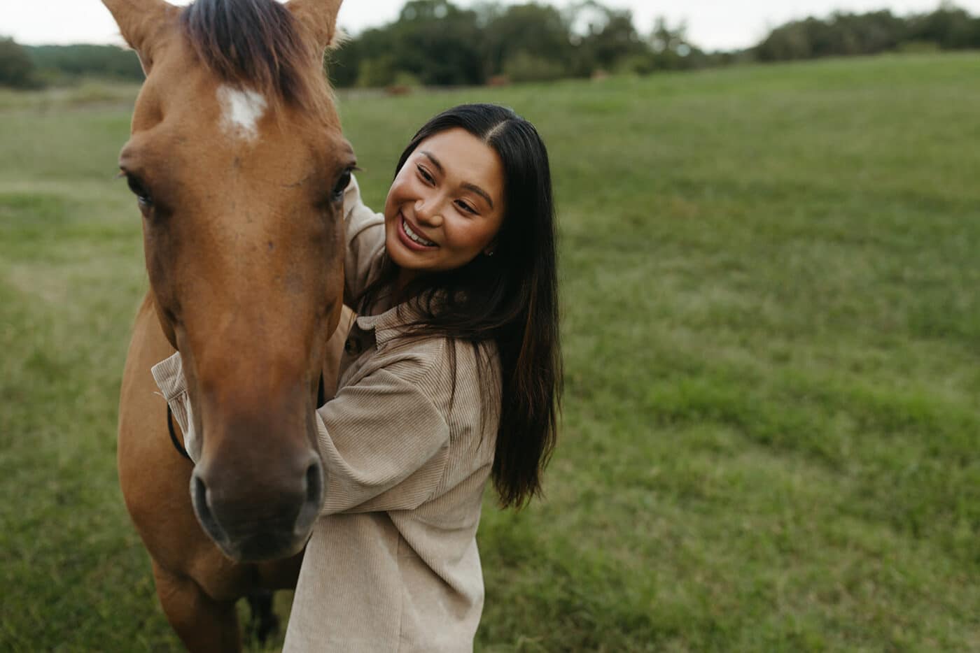 A woman hugging a horse