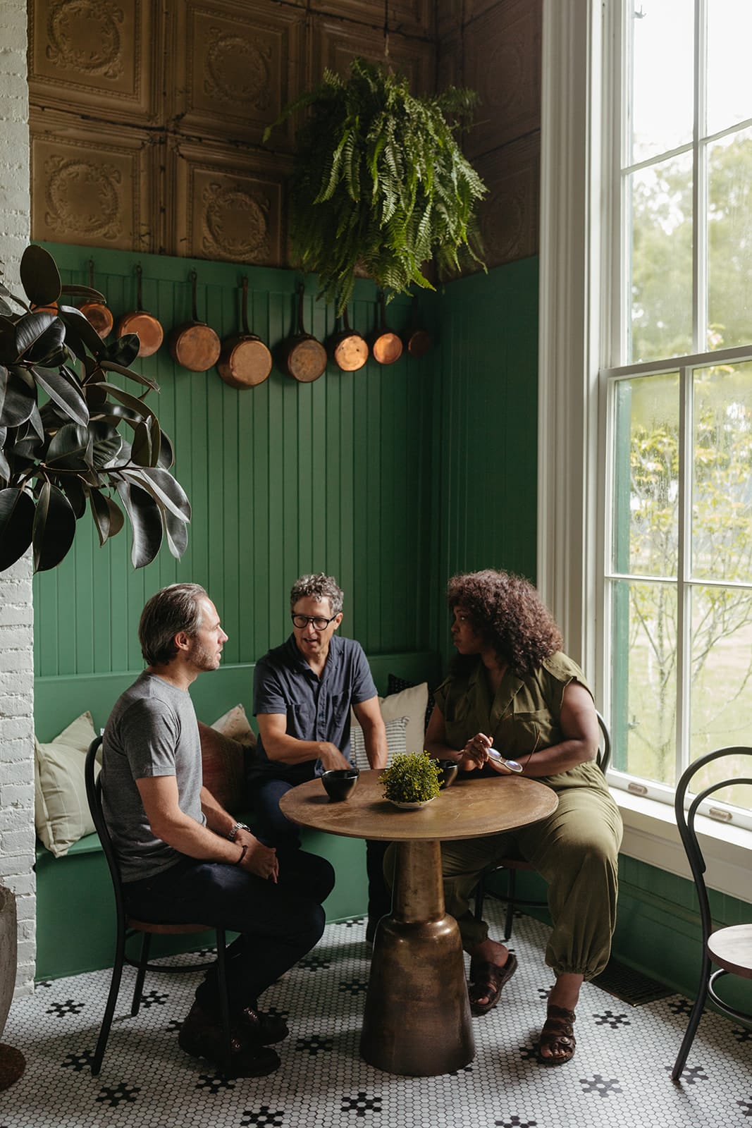 A group of people chatting at a small table