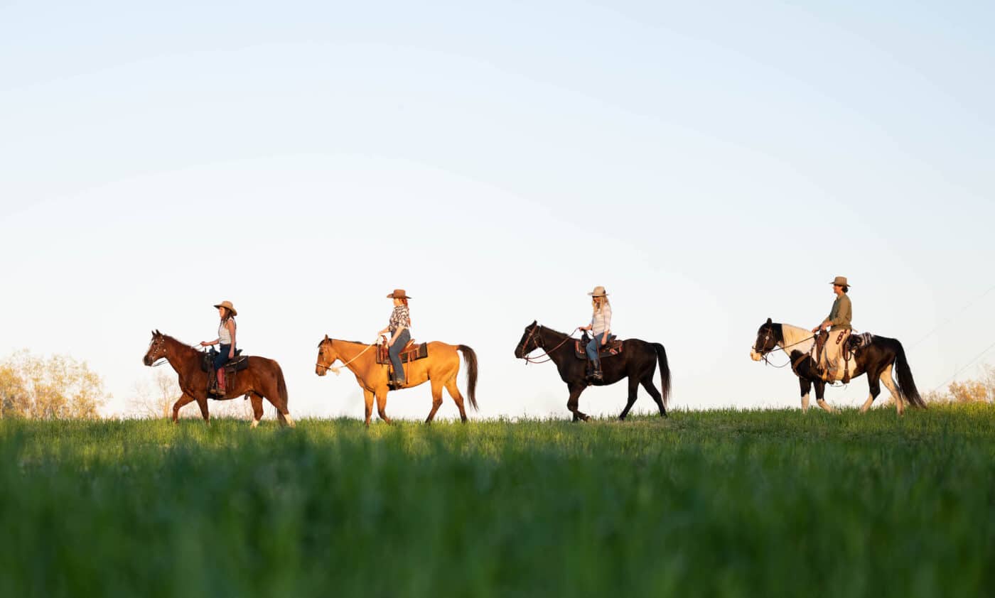 Group of people riding horses