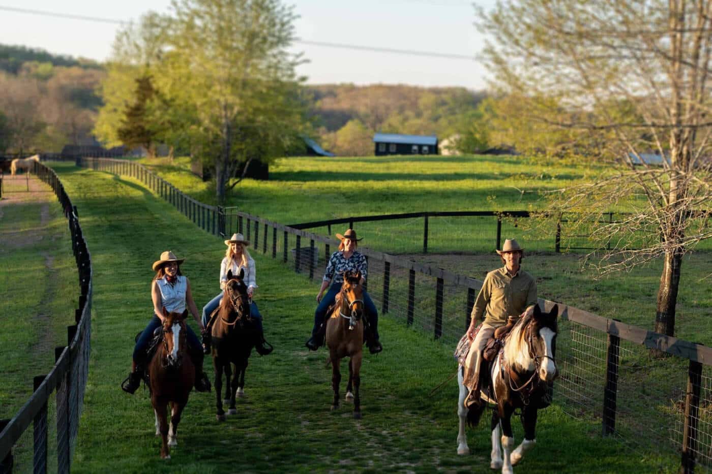 A group of people riding horses